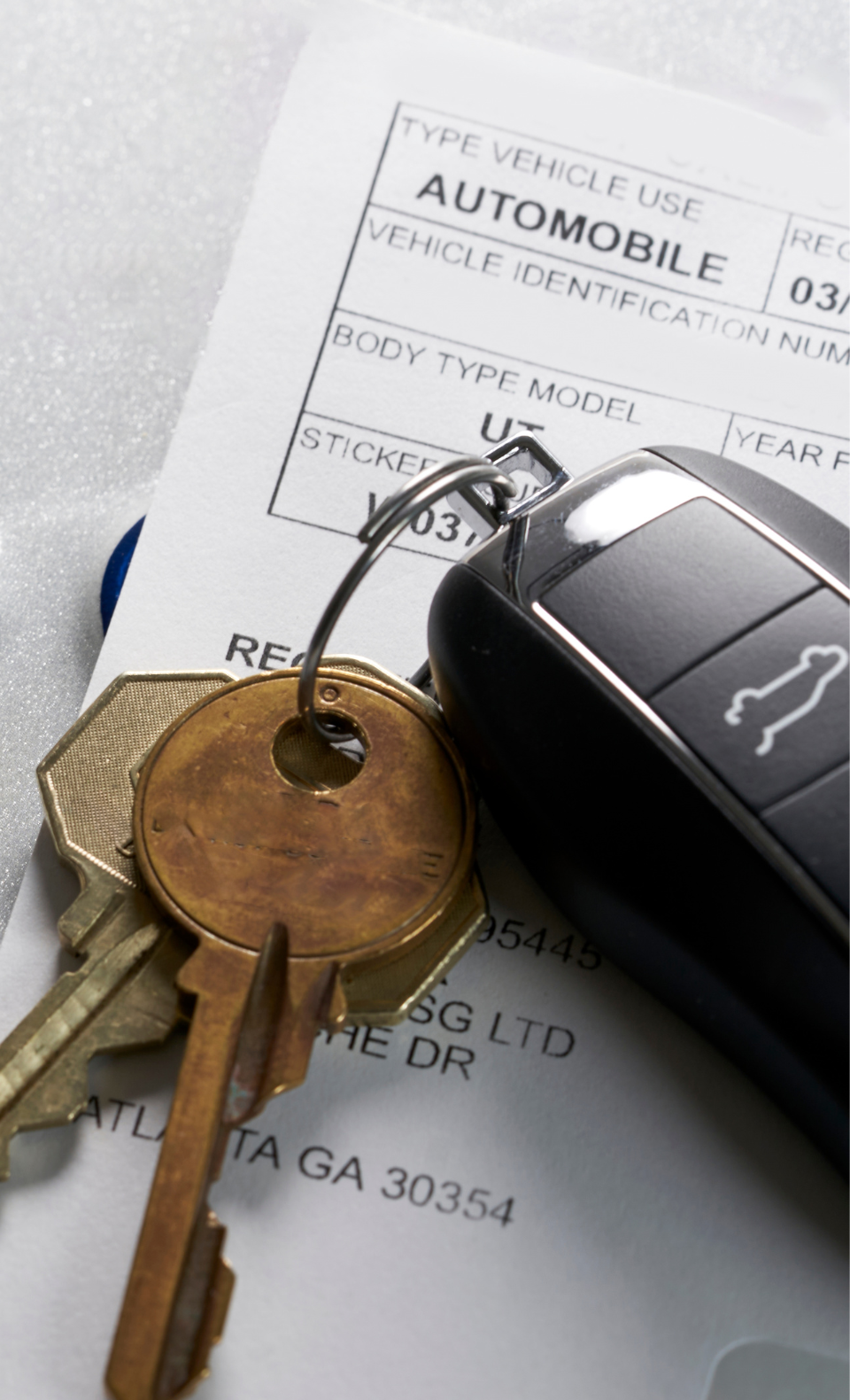 Vehicle Registration Keys and Document Close-up of car keys and a vehicle registration document, representing South Dakota vehicle registration services.